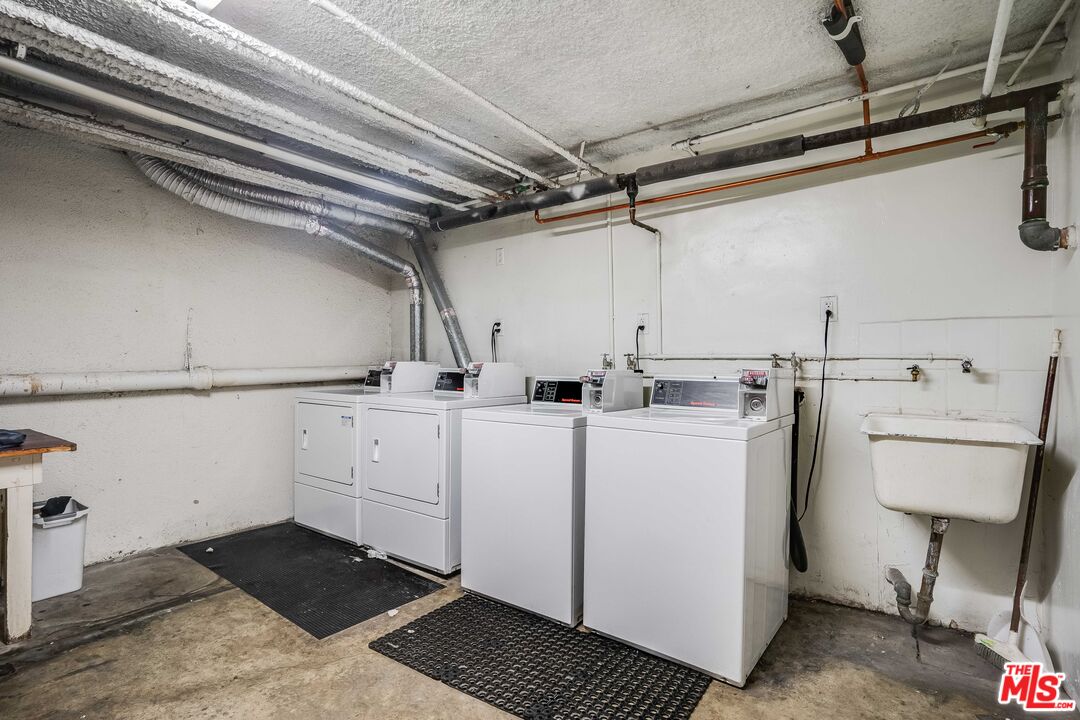 7548 Hampton Avenue, Unit 304 West Hollywood, CA 90046 - Photo 21 of 23 a utility room with cabinets