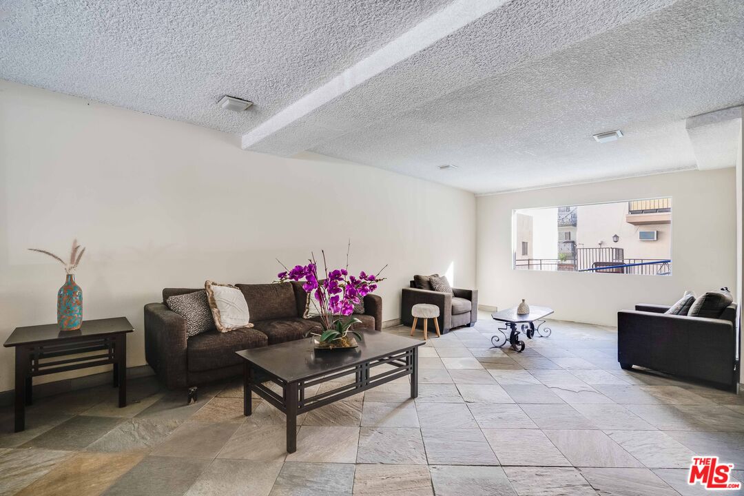 7548 Hampton Avenue, Unit 304 West Hollywood, CA 90046 - Photo 23 of 23 a living room with furniture