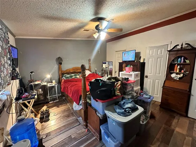 a bed room with a bed window and dresser