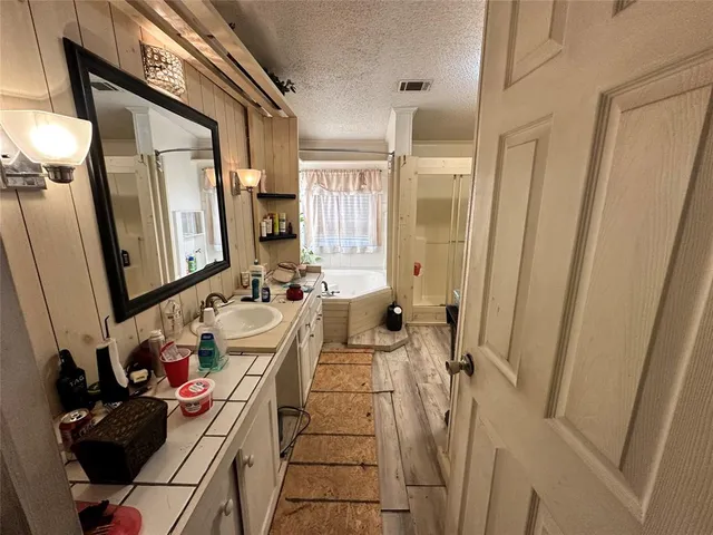 a bathroom with a sink toilet and a mirror