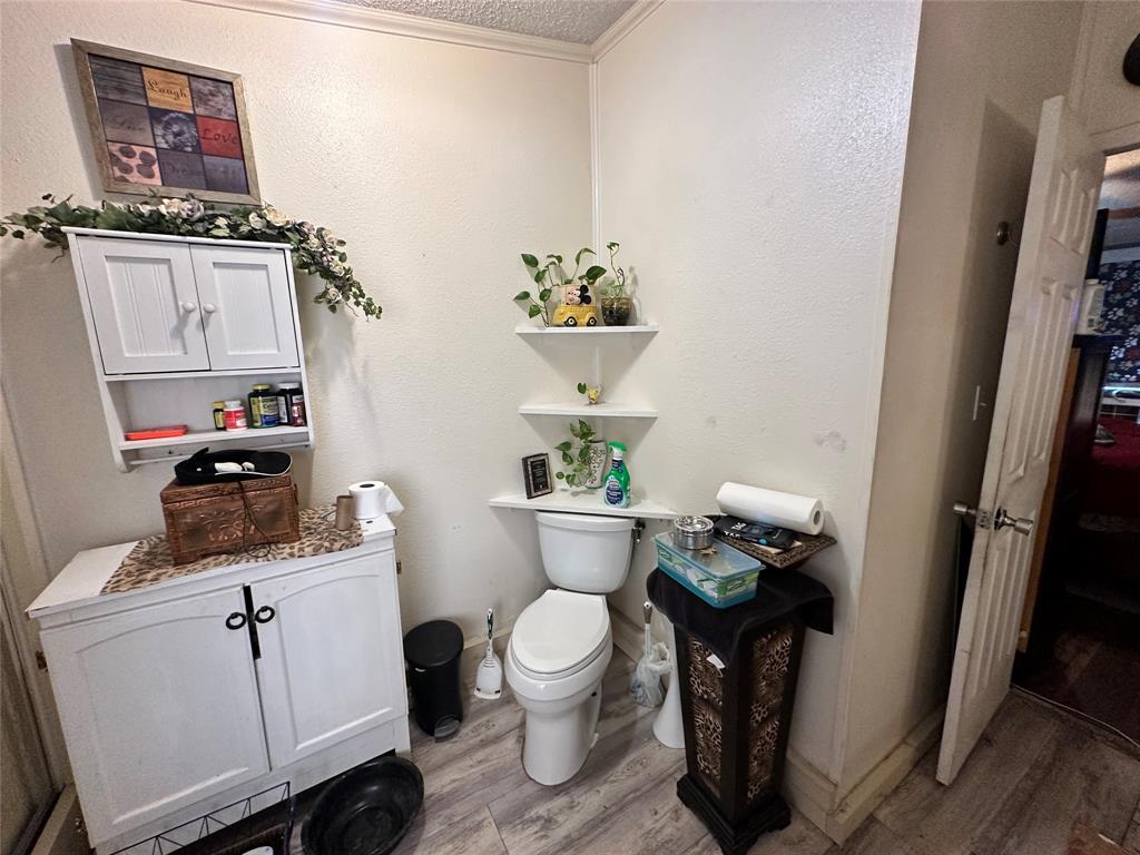 13925 Briar Road Azle, TX 76020 - Photo 17 of 22 a bathroom with a sink toilet and a mirror