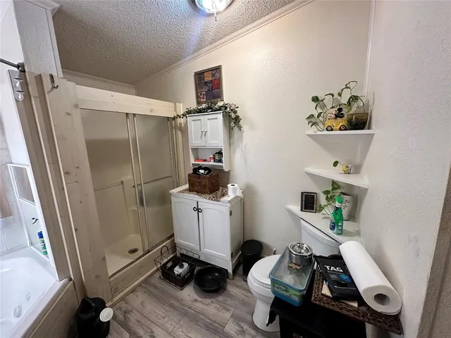 a bathroom with a tub and a shower