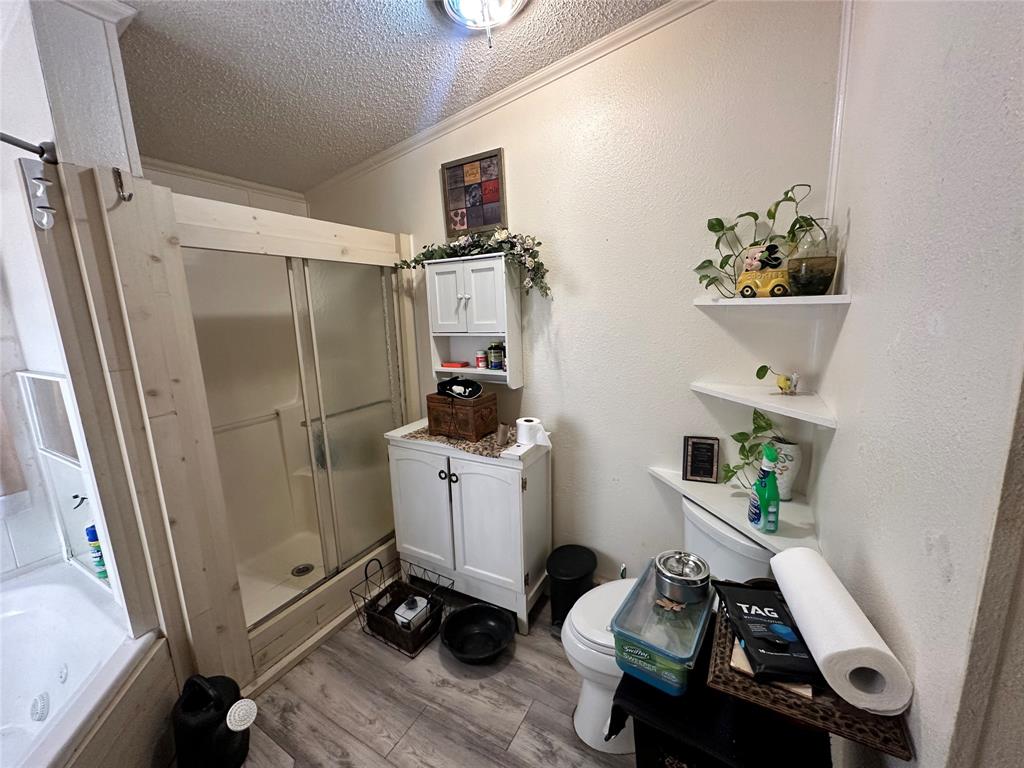 13925 Briar Road Azle, TX 76020 - Photo 18 of 22 a room with storage and utility