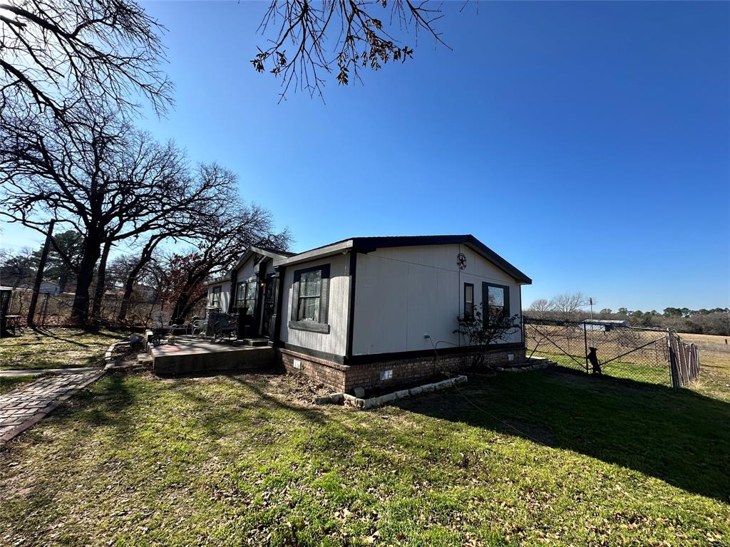 13925 Briar Road Azle, TX 76020 - Photo 2 of 22 a front view of a house with a yard