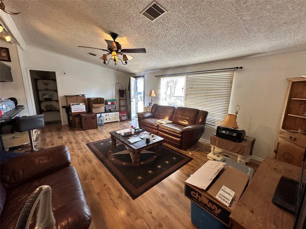 13925 Briar Road Azle, TX 76020 - Photo 7 of 22 a living room with furniture and a window