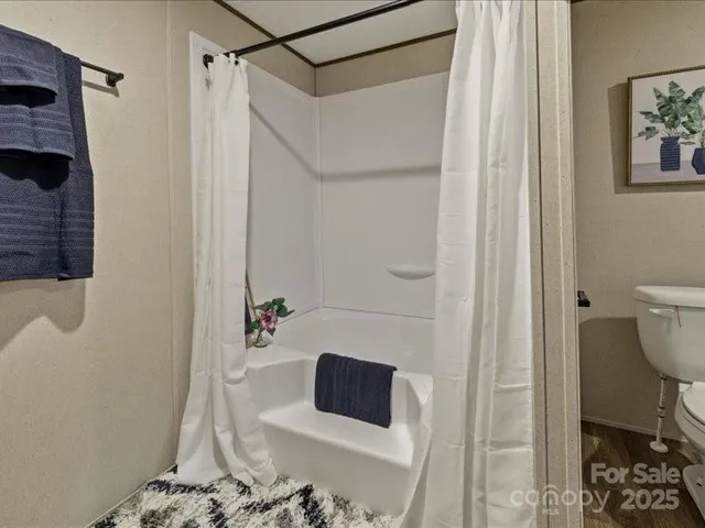 a bathroom with a sink and a shower curtain