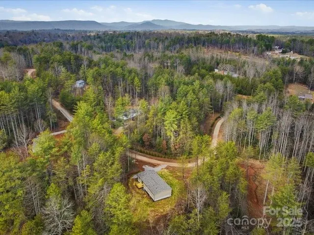 a view of a backyard with swimming pool