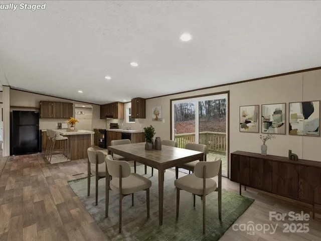 a view of a dining room with furniture and window