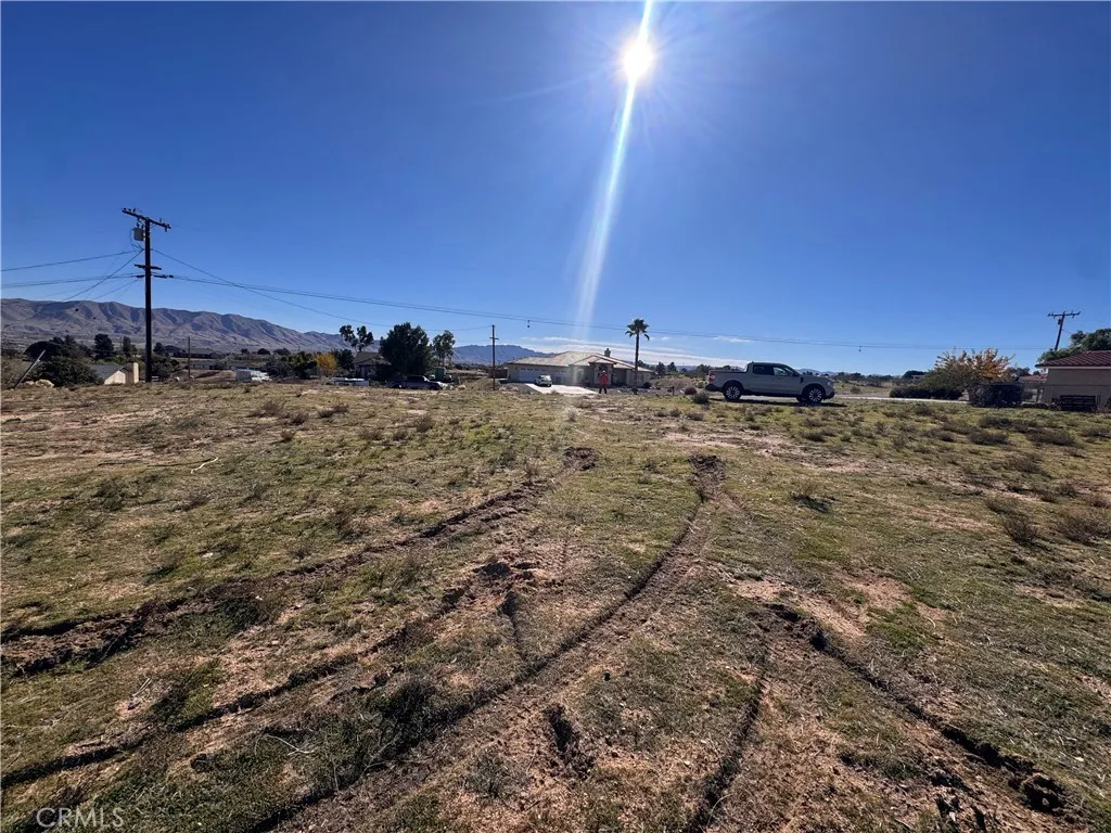0 Talisman Street Hesperia, CA 92345 - Photo 13 of 15 a view of a dry yard with trees
