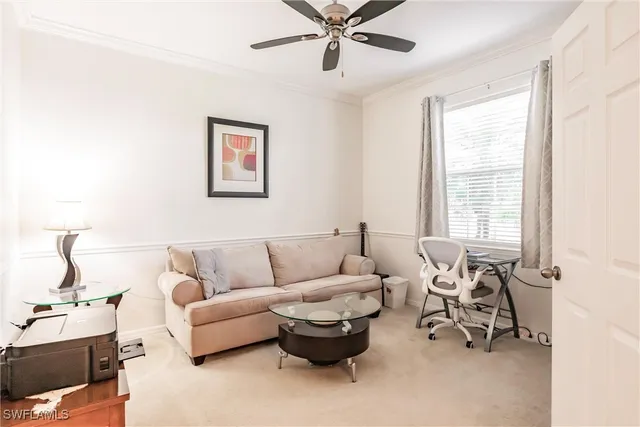 a living room with furniture and white walls