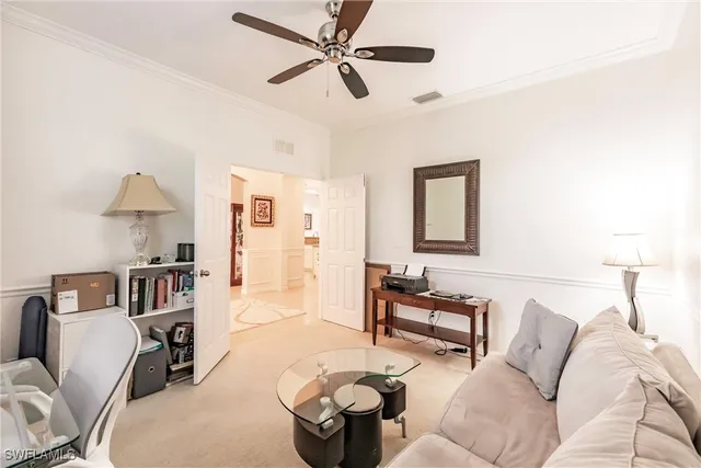 a living room with furniture and a lamp