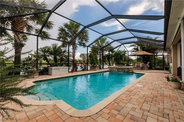a view of a swimming pool with a patio