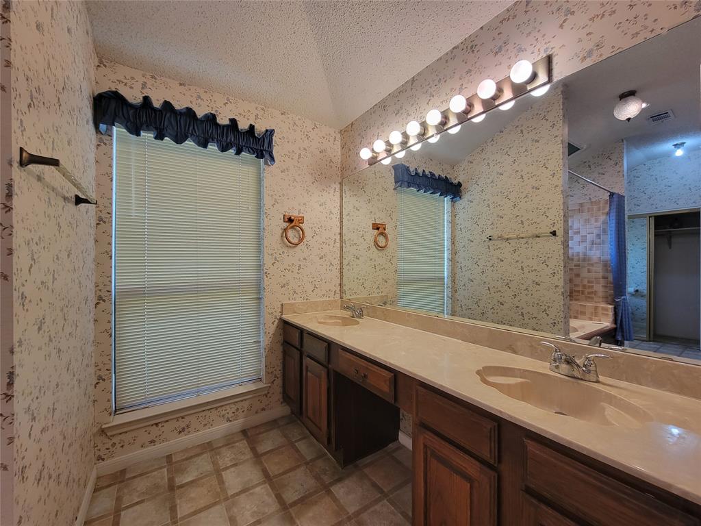 630 Country View Lane Garland, TX 75043 - Photo 16 of 29 Bathroom vanity with dual integrated sinks and a spacious countertop