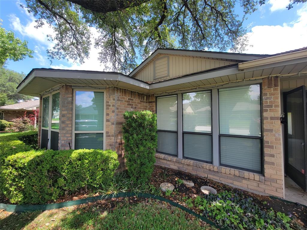 630 Country View Lane Garland, TX 75043 - Photo 3 of 29 Brick exterior with tan siding features a bay window and multiple large windows with blinds