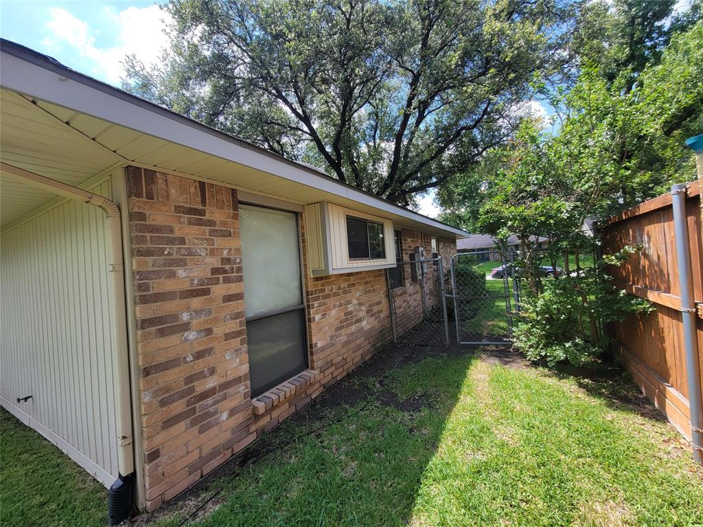 630 Country View Lane Garland, TX 75043 - Photo 4 of 29 Brick exterior with a beige soffit and fascia