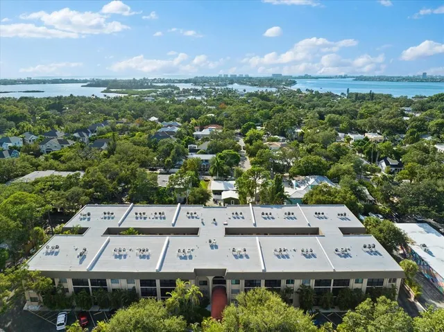 an aerial view of a building with trees