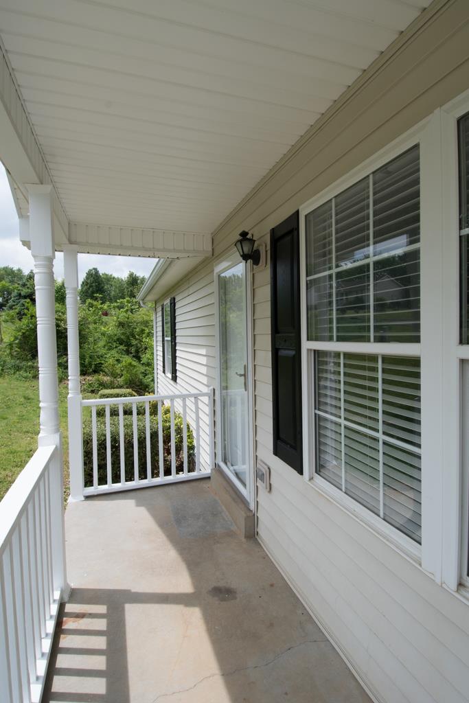 121 Brookside Point Springfield, TN 37172 - Photo 16 of 19 a porch with a bench next to a yard