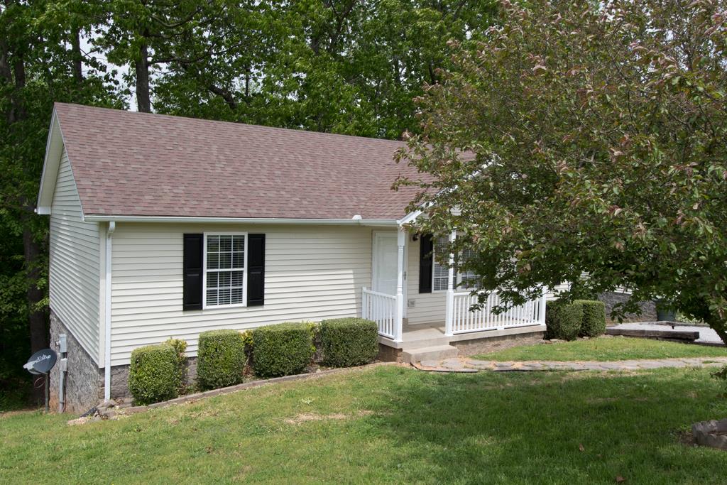 121 Brookside Point Springfield, TN 37172 - Photo 18 of 19 a front view of a house with garden