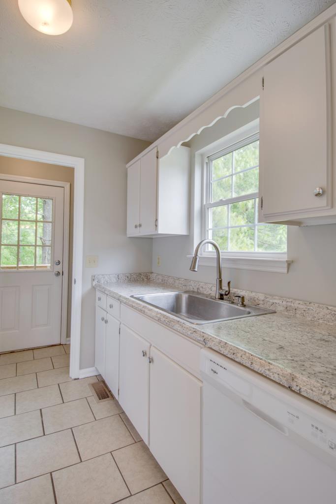 121 Brookside Point Springfield, TN 37172 - Photo 5 of 19 a kitchen with a sink cabinets and window