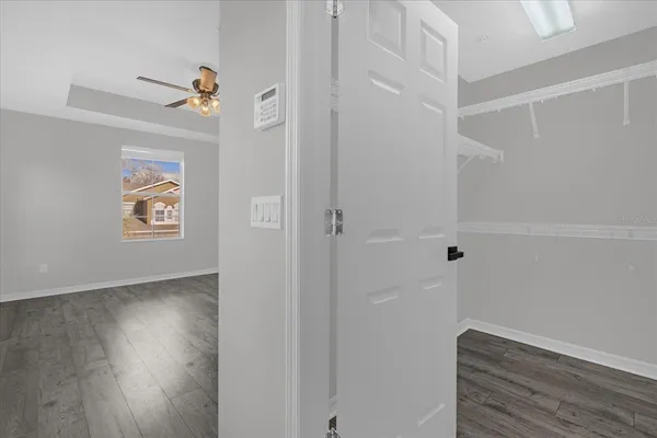 a view of hallway with wooden floor