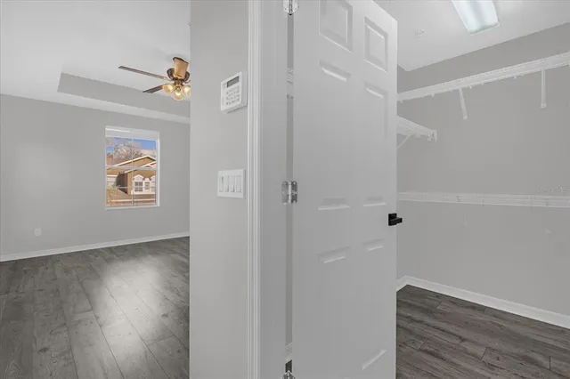 a view of hallway with wooden floor