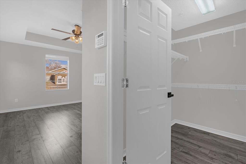 9450 Silver Buttonwood Street Orlando, FL 32832 - Photo 13 of 25 a view of hallway with wooden floor