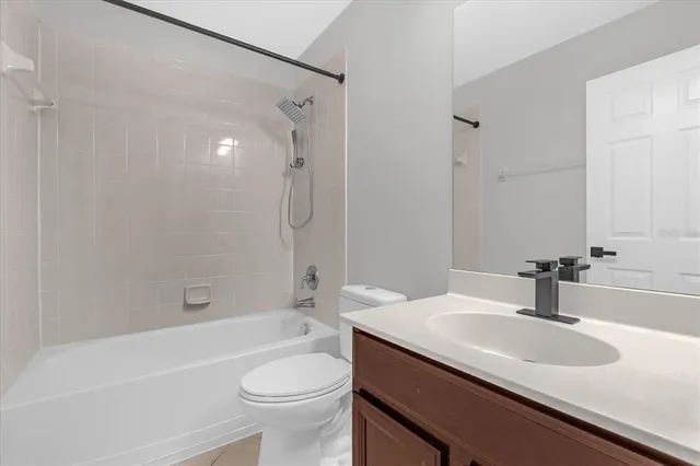 a bathroom with a sink a toilet and a bathtub