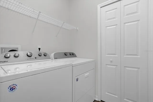 a utility room with dryer and washer