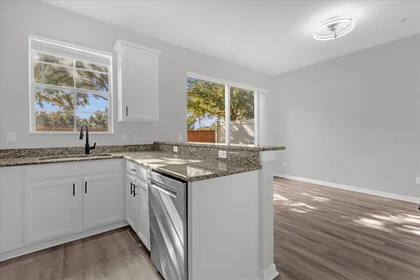 a kitchen with a sink and cabinets