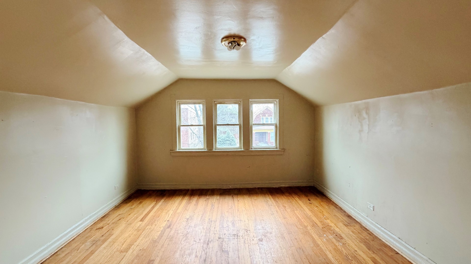 7704 South Ada Street Chicago, IL 60620 - Photo 6 of 10 an empty room with a window