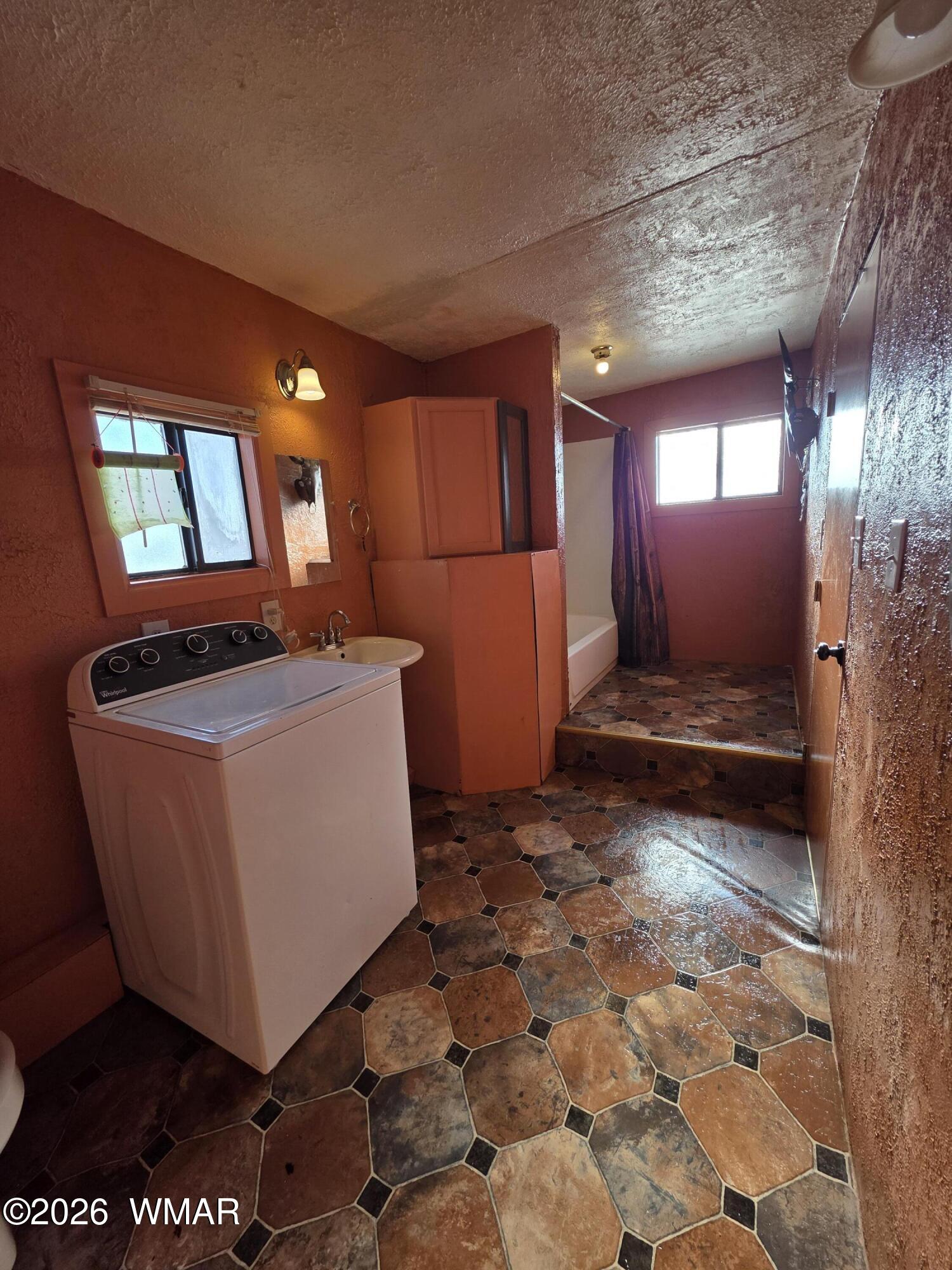 80 L K Ranch Road Holbrook, AZ 86025 - Photo 21 of 29 a room with water heater and a rug