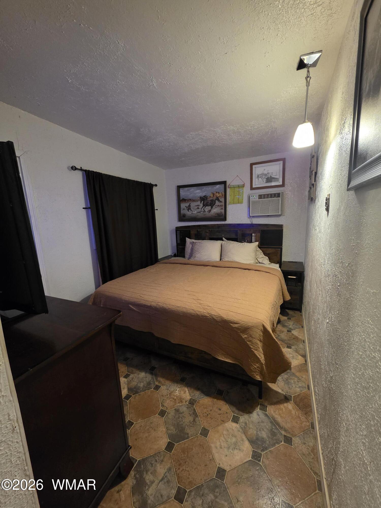 80 L K Ranch Road Holbrook, AZ 86025 - Photo 22 of 29 a bedroom with a bed and dresser