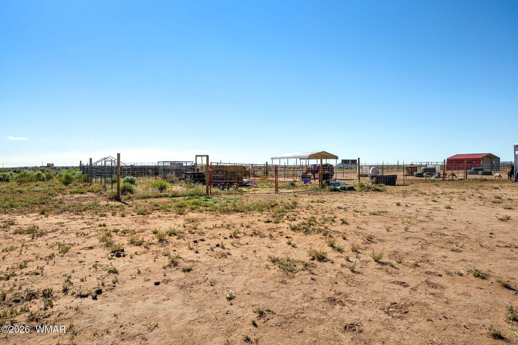 80 L K Ranch Road Holbrook, AZ 86025 - Photo 23 of 29 a view of a dry yard with trees