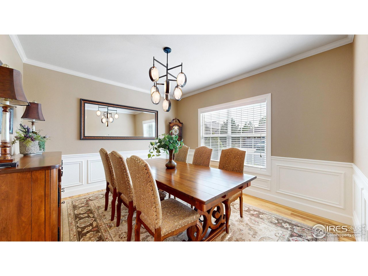 8398 Spinnaker Bay Drive Windsor, CO 80528 - Photo 14 of 40 a living room with furniture and a large window