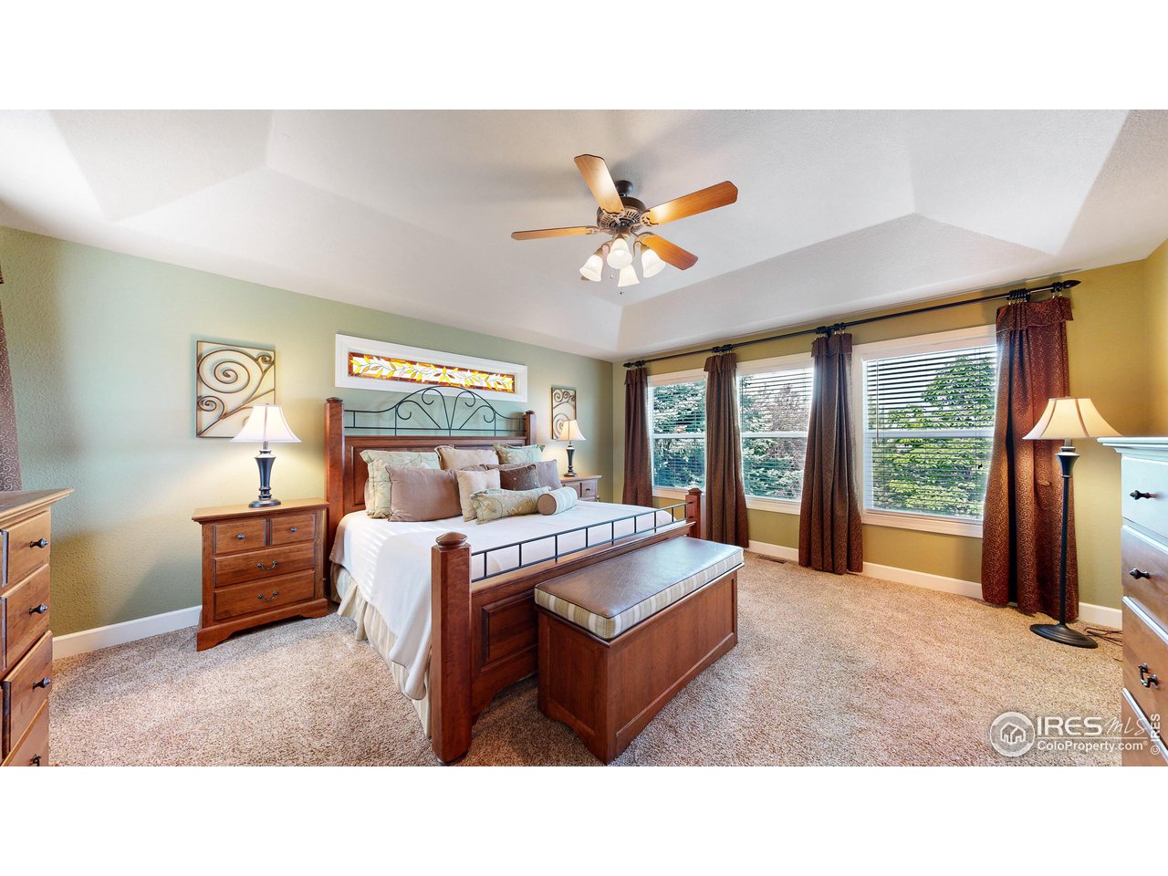 8398 Spinnaker Bay Drive Windsor, CO 80528 - Photo 16 of 40 a living room with furniture and a large window