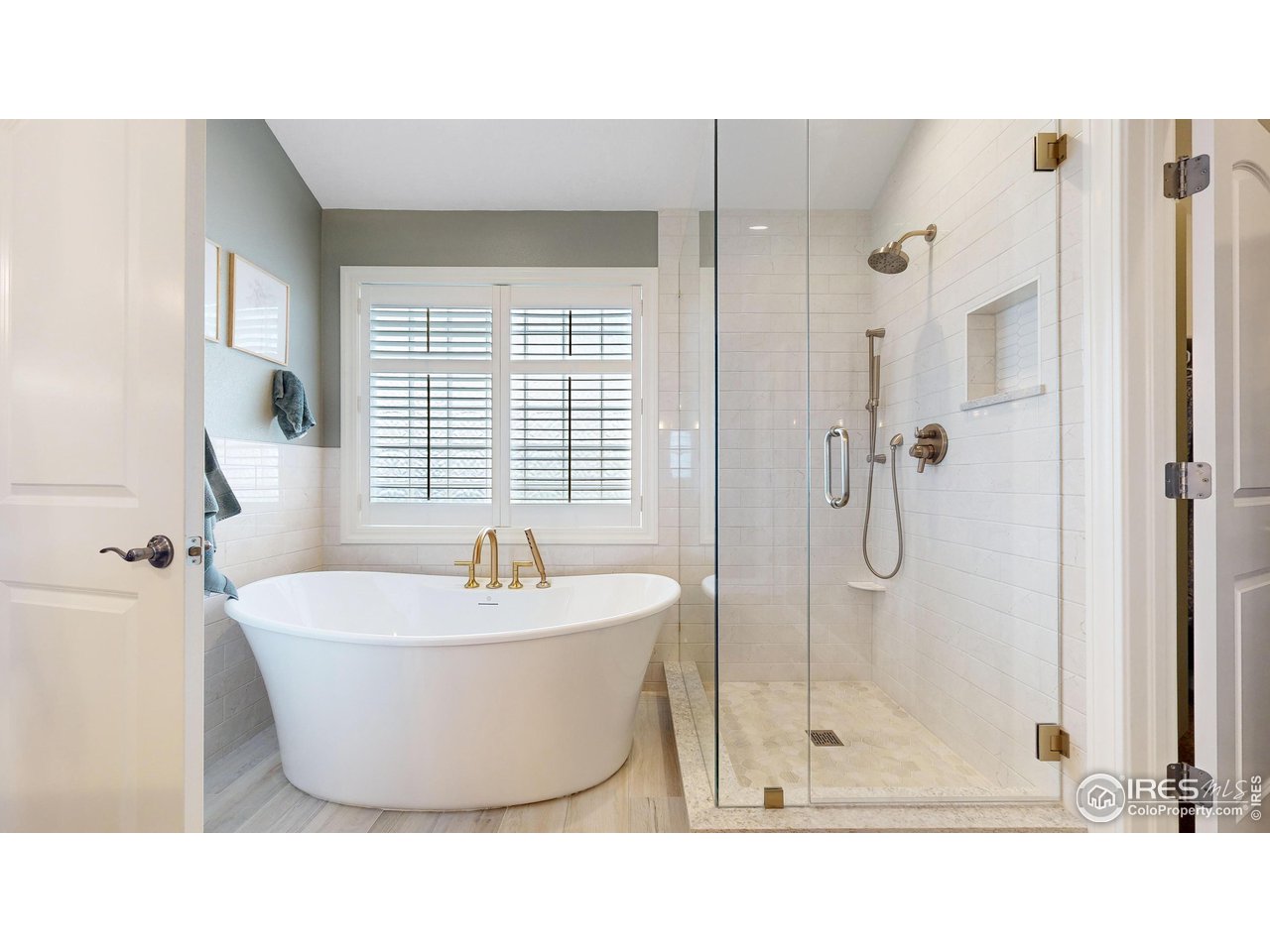 8398 Spinnaker Bay Drive Windsor, CO 80528 - Photo 18 of 40 a bathroom with a bathtub and shower