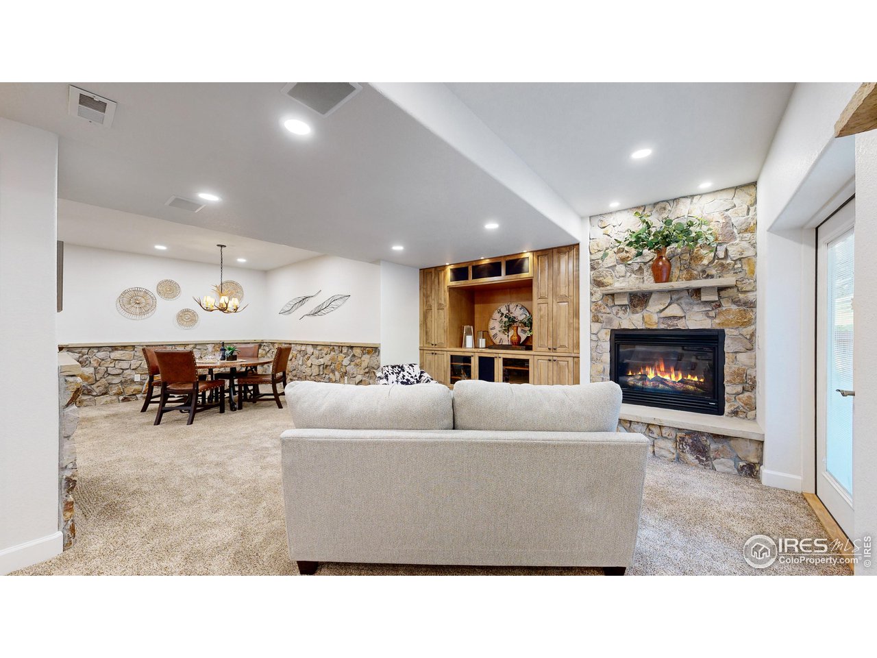 8398 Spinnaker Bay Drive Windsor, CO 80528 - Photo 27 of 40 a living room with furniture and a fireplace