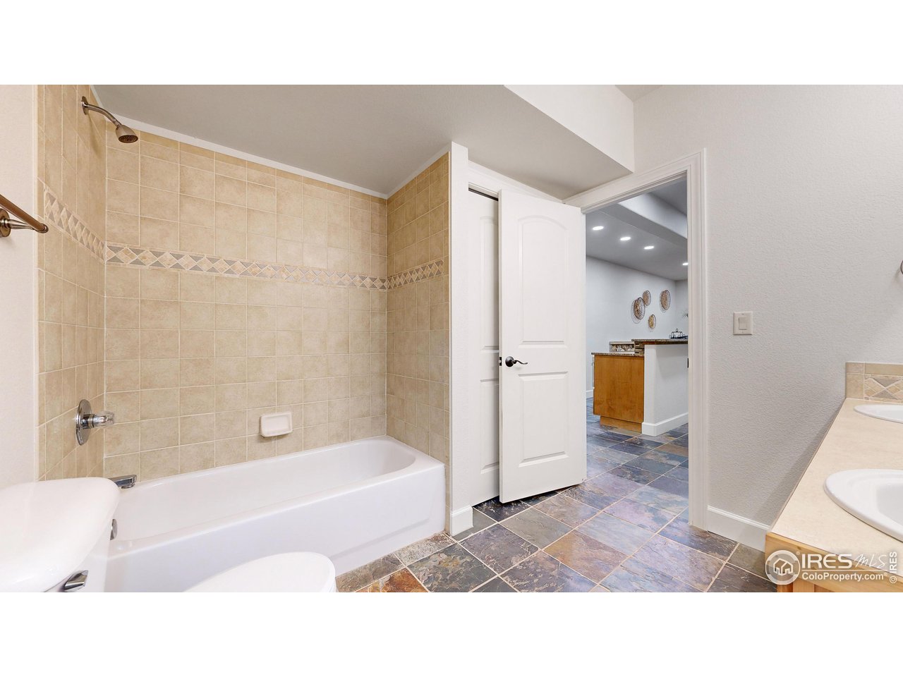 8398 Spinnaker Bay Drive Windsor, CO 80528 - Photo 30 of 40 a bathroom with a bathtub and a shower