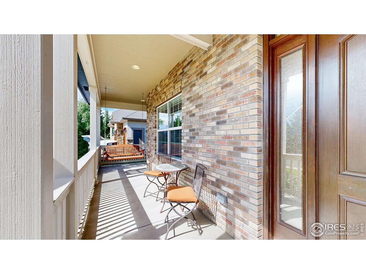 8398 Spinnaker Bay Drive Windsor, CO 80528 - Photo 3 of 40 a outdoor living space with furniture