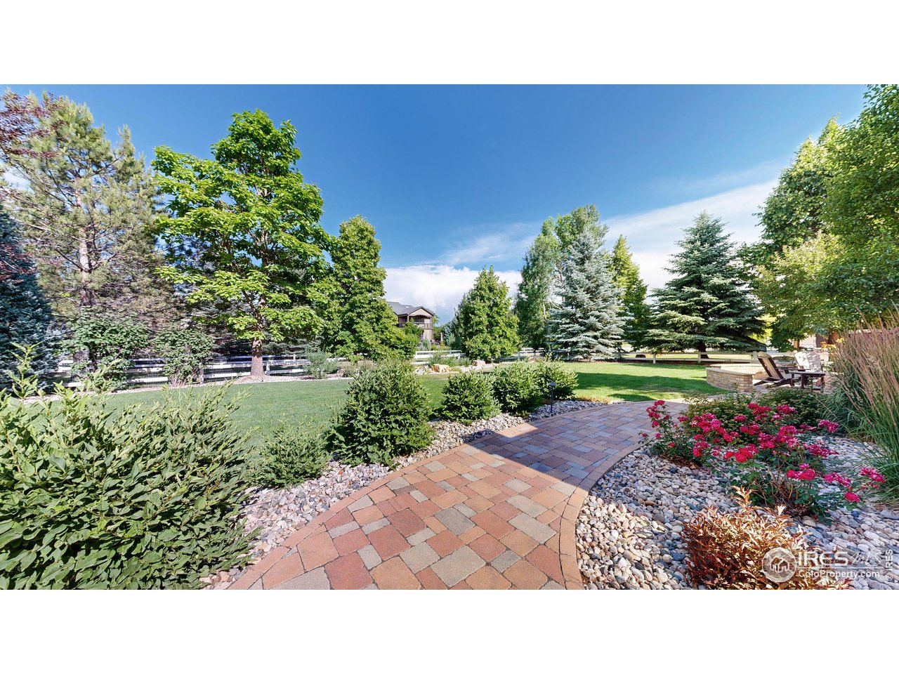 8398 Spinnaker Bay Drive Windsor, CO 80528 - Photo 31 of 40 a picture of a bench in middle of garden