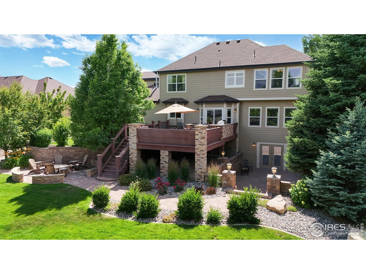 8398 Spinnaker Bay Drive Windsor, CO 80528 - Photo 36 of 40 a aerial view of a house with a yard table and chairs