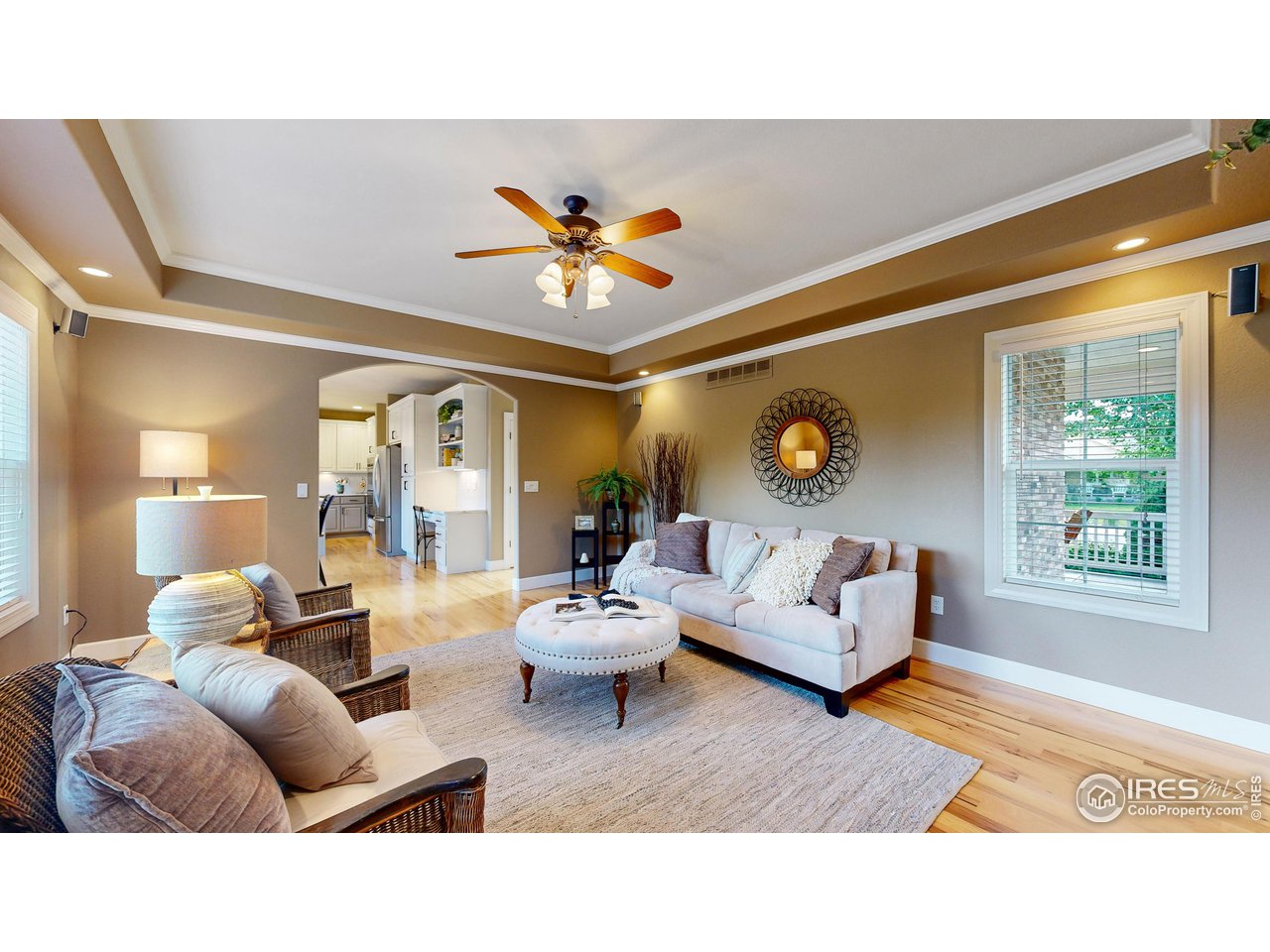 8398 Spinnaker Bay Drive Windsor, CO 80528 - Photo 5 of 40 a living room with furniture and a large window