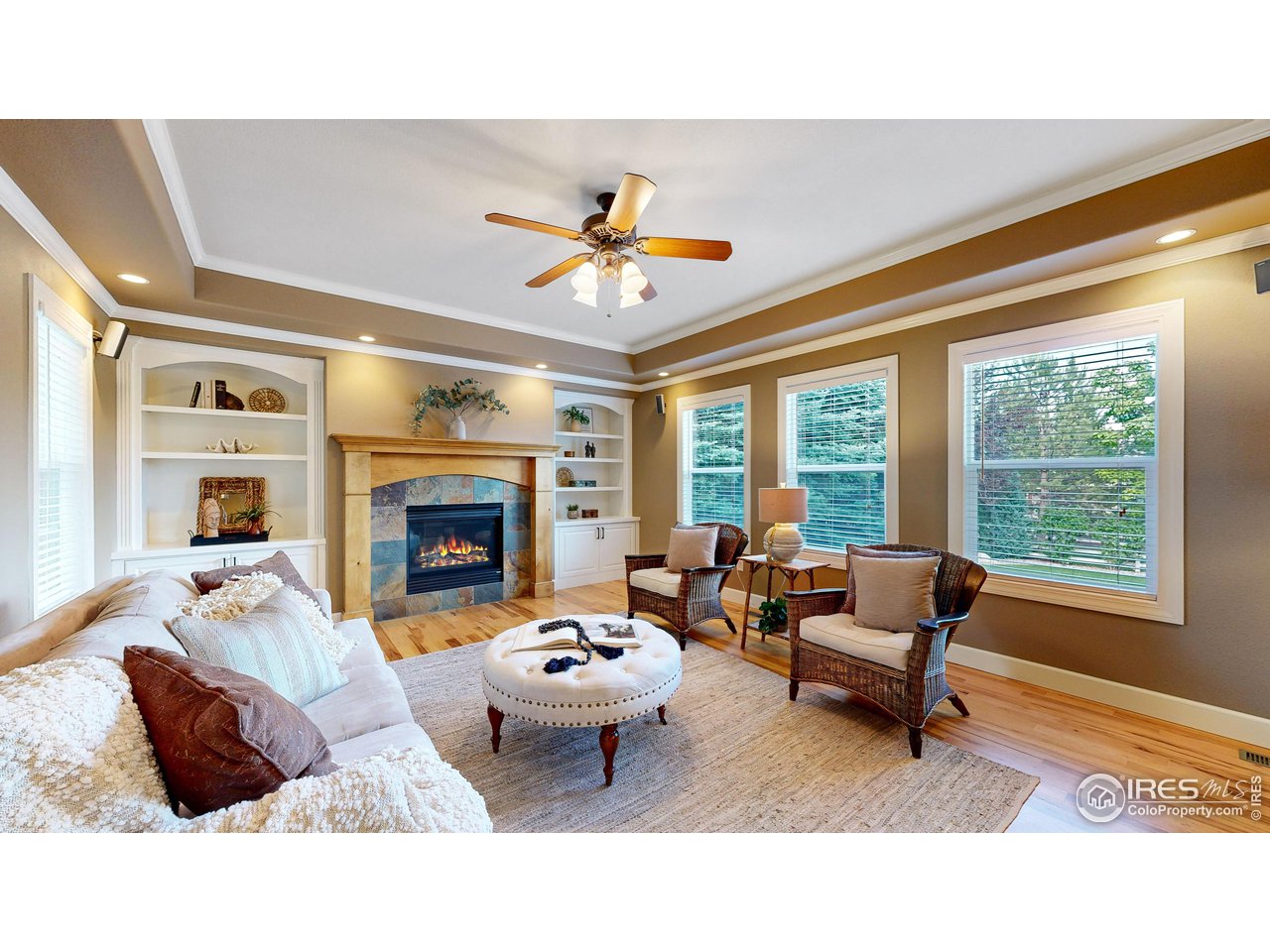 8398 Spinnaker Bay Drive Windsor, CO 80528 - Photo 6 of 40 a living room with furniture and a fireplace
