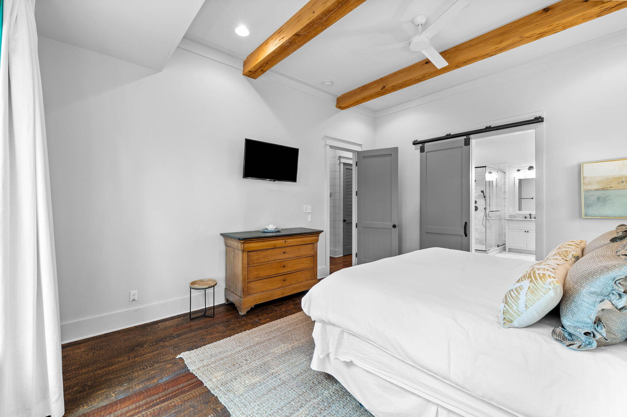 213 Bramble Street Santa Rosa Beach, FL 32459 - Photo 29 of 62 a bedroom with a bed and a flat screen tv
