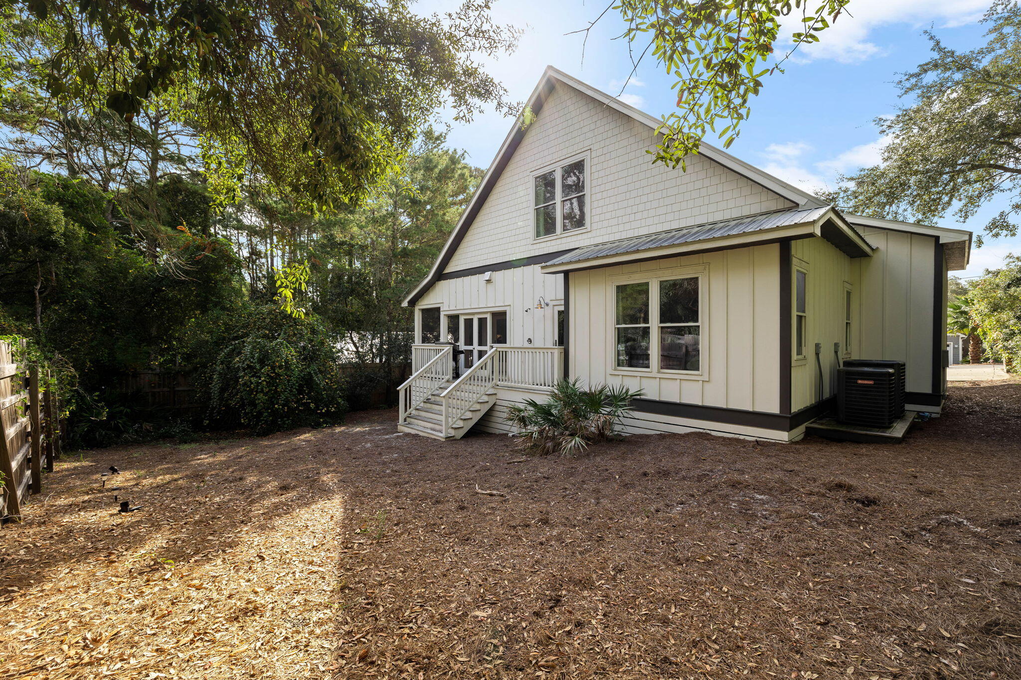 213 Bramble Street Santa Rosa Beach, FL 32459 - Photo 50 of 62 a view of a house with a yard