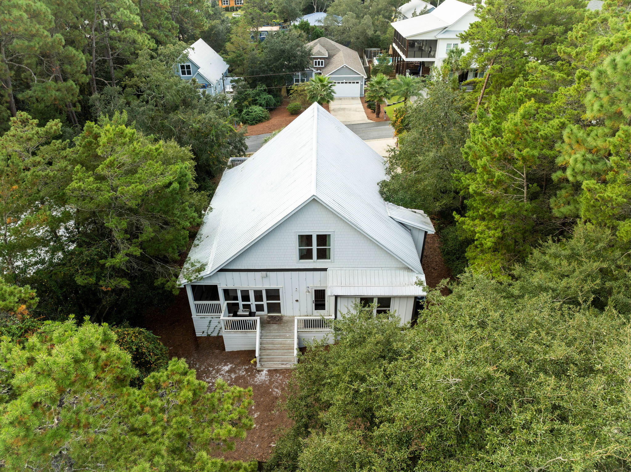 213 Bramble Street Santa Rosa Beach, FL 32459 - Photo 51 of 62 a aerial view of a house with a yard and sitting area