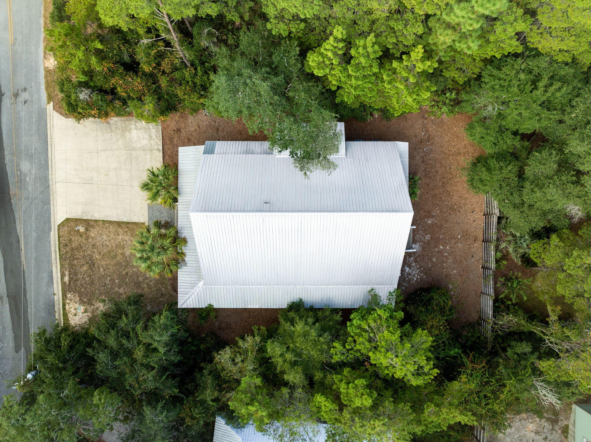 213 Bramble Street Santa Rosa Beach, FL 32459 - Photo 54 of 62 an aerial view of a house with a garden and trees