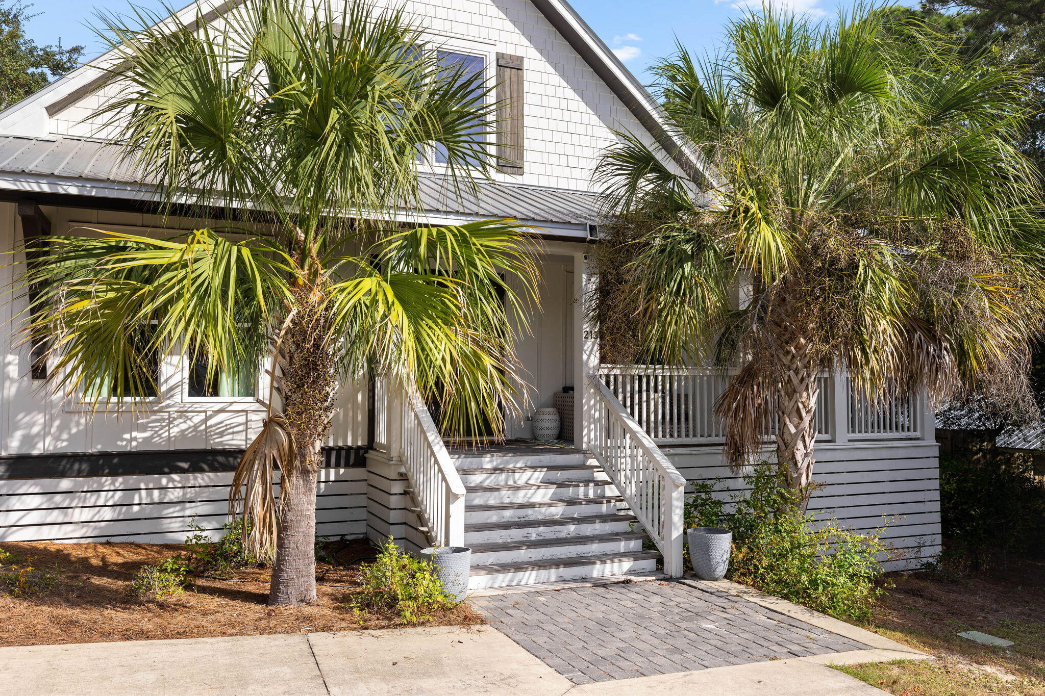 213 Bramble Street Santa Rosa Beach, FL 32459 - Photo 7 of 62 a view of a palm trees in front of a house