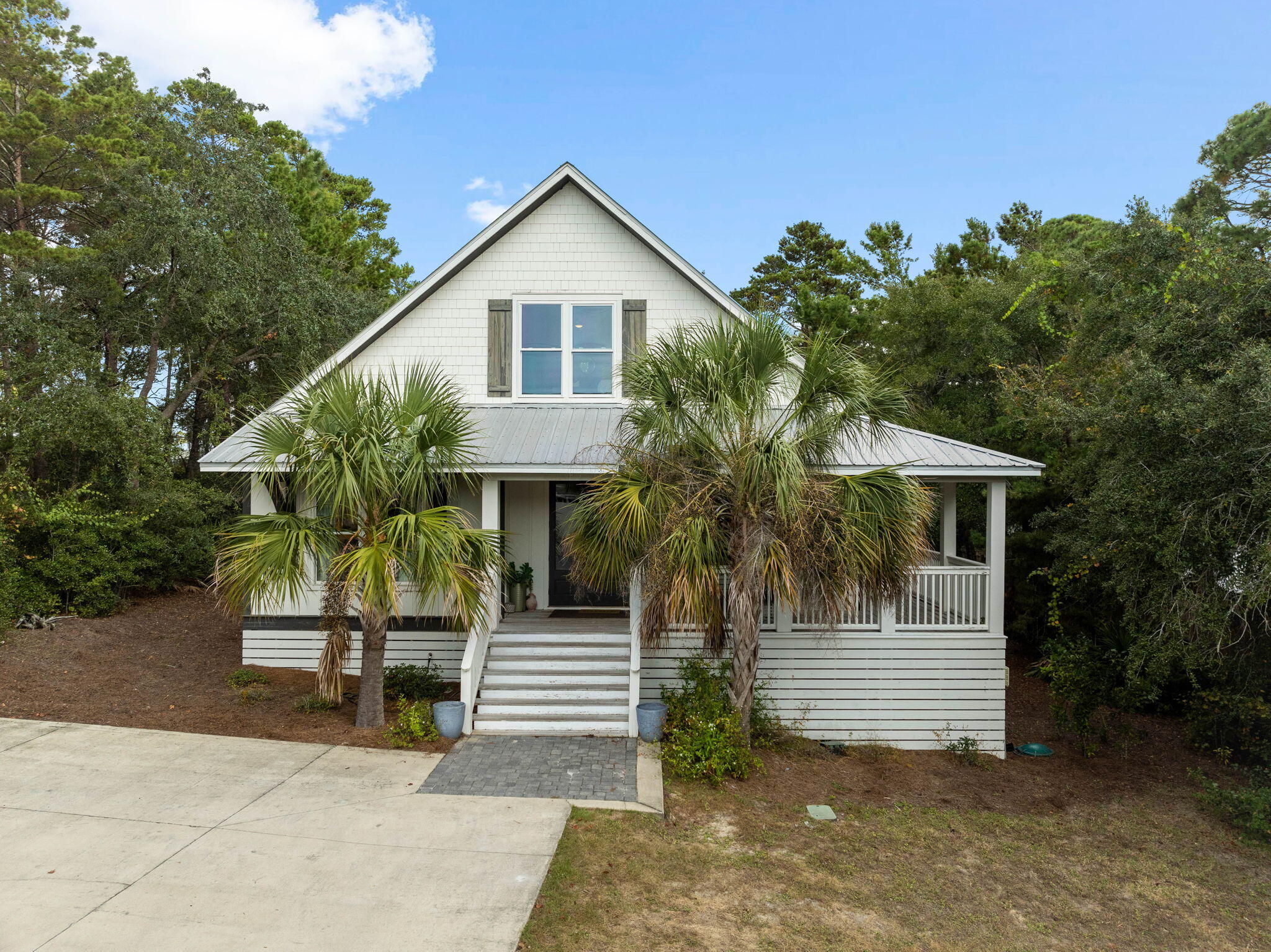 213 Bramble Street Santa Rosa Beach, FL 32459 - Photo 9 of 62 a front view of a house with garden