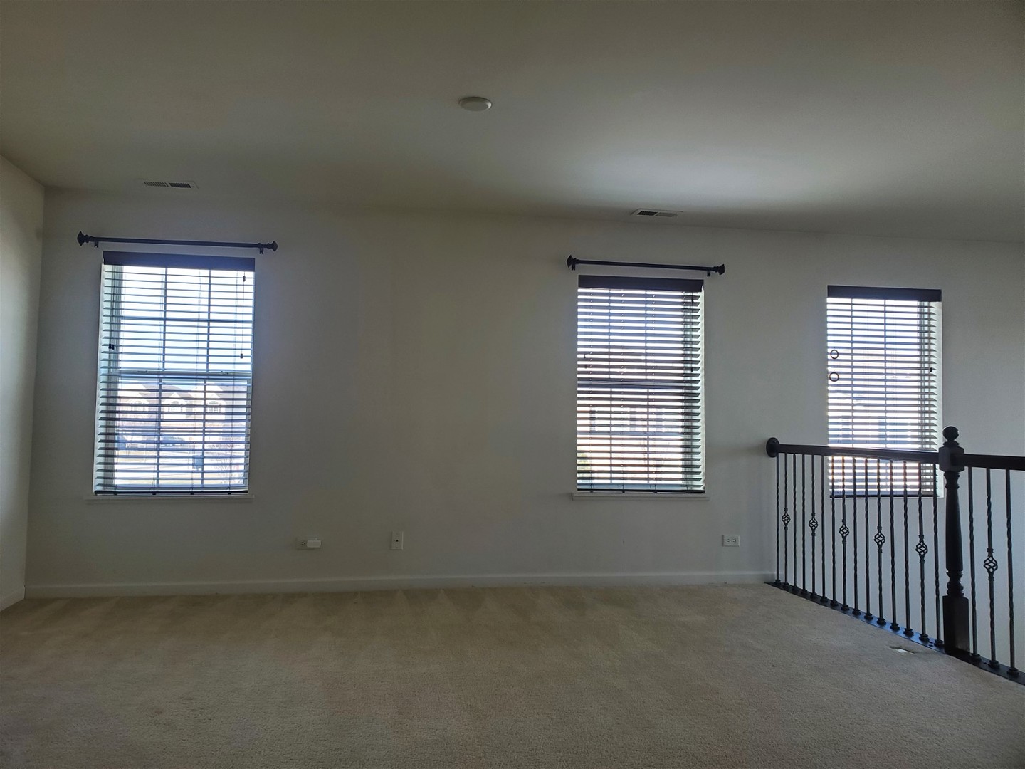 10070 Cummings Street, Unit 3401 Huntley, IL 60142 - Photo 16 of 27 an empty room with windows